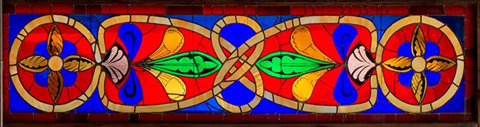 The 1974 stained glass window located on the walkway down to the Cowell Dining Hall. 